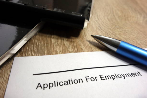 istock Application for employment, pen and briefcases 941407128
