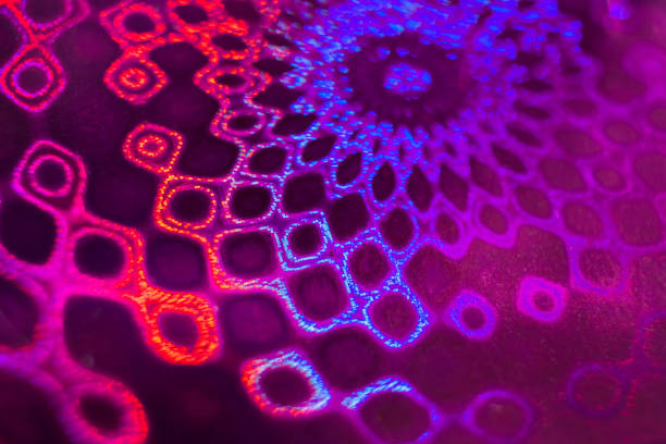 istock Close-up round pink-violet- blue holographic pattern similar lace. 941407736
