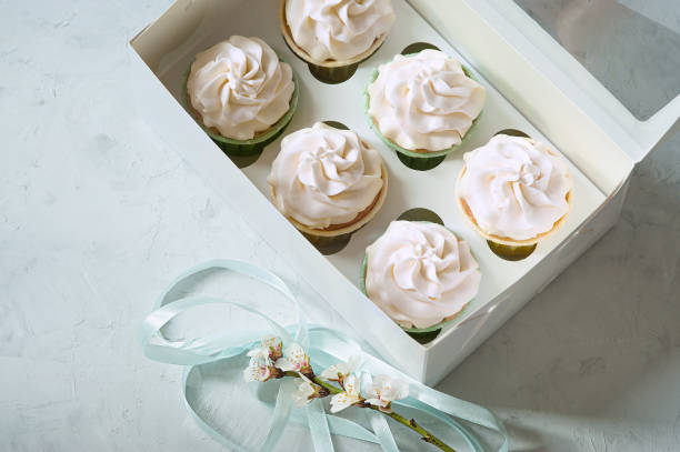 istock dessert cupcakes in a gift box. place for inscription 941410404