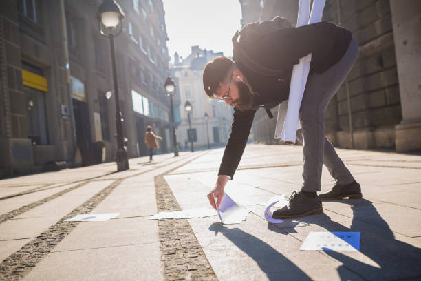 istock Papers spilling from businessman folder while he is rushing to the office 941412506