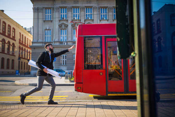 istock Businessman trying to catch the bus 941412630