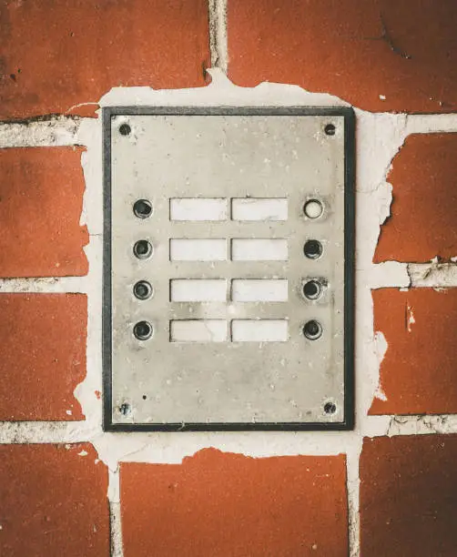 old house door bells on a brick wall