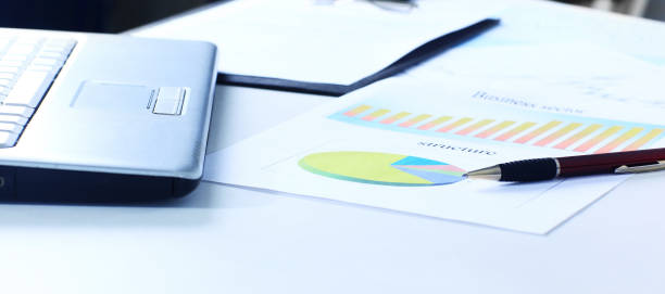 istock calculator and a marketing scheme on the table from a businessm 941416674