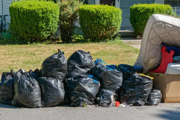 Garbage Bags and Trash waiting for garbage truck.