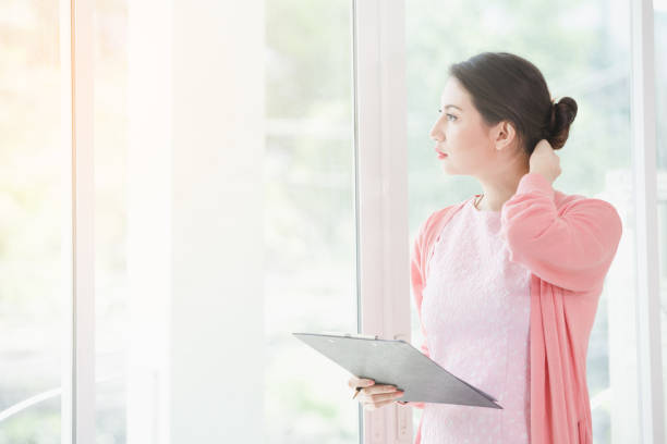 istock Business woman standing working 941428560