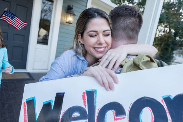 istock Relieved wife hugs soldier husband 941439816