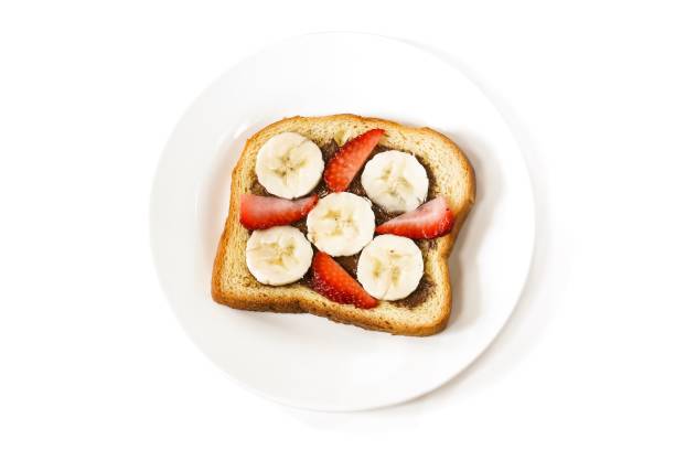 istock Strawberry banana breakfast Toast isolated on white 941439890