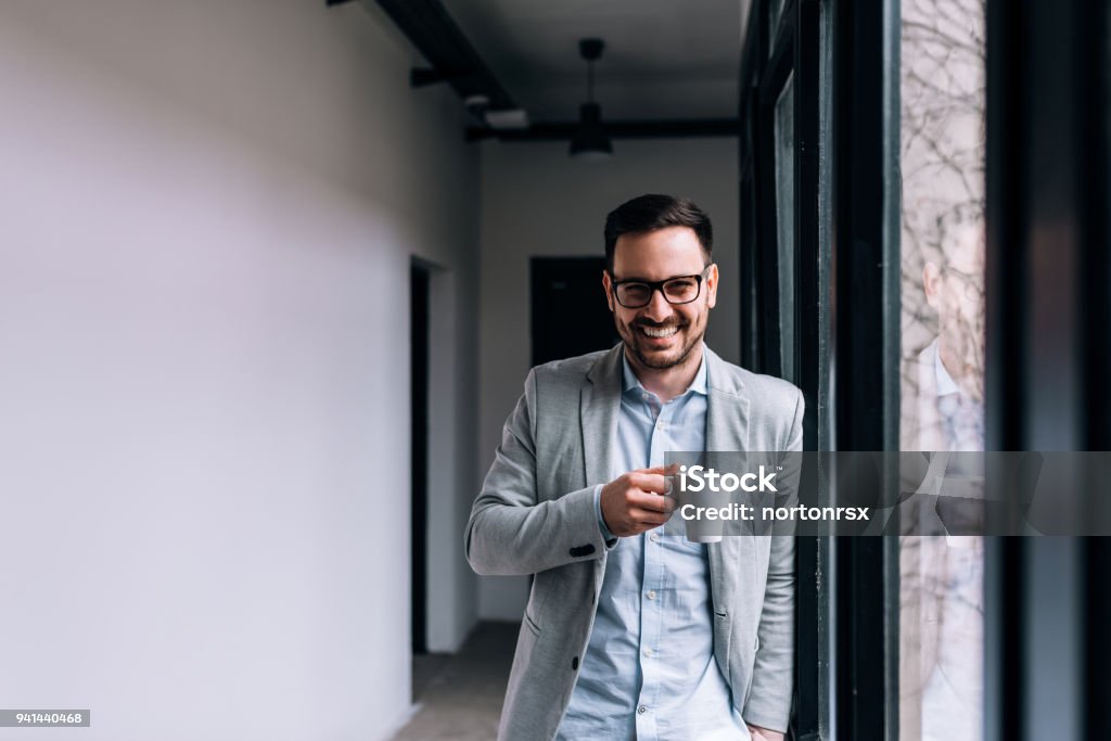 Portrait of a smiling businessman having a break. Coffee - Drink Stock Photo