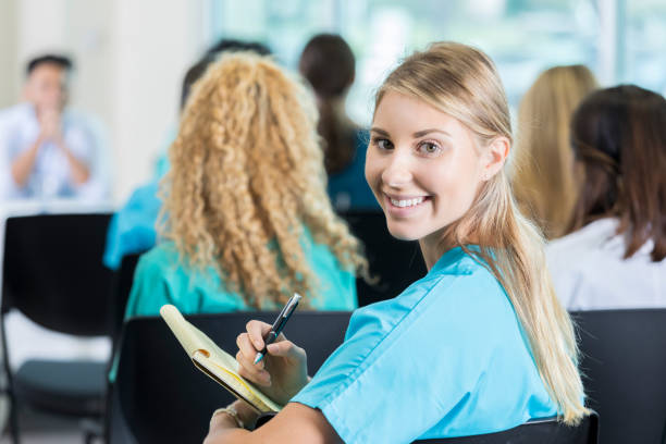istock Young female medical student takes class notes 941440566