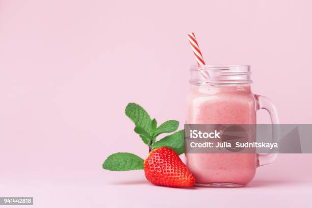 Strawberry Smoothie Or Milkshake In Mason Jar Decorated Mint On Pink Table Healthy Food For Breakfast And Snack Stock Photo - Download Image Now