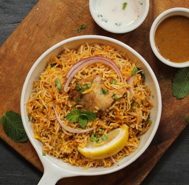 istock Hyderabadi Chicken Biryani served with Yogurt raita and Salan 941443444