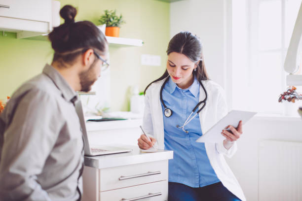 istock Doctor consulting her patient 941443522