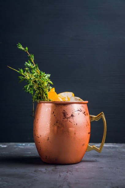 istock Cold orange Moscow mule cocktail in copper mug 941446406