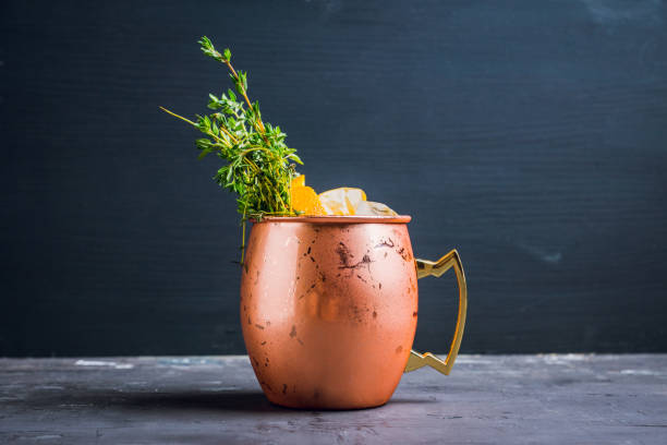 istock Cold orange Moscow mule cocktail in copper mug 941446416