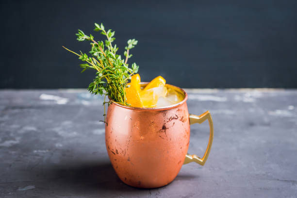istock Cold orange Moscow mule cocktail in copper mug 941446422