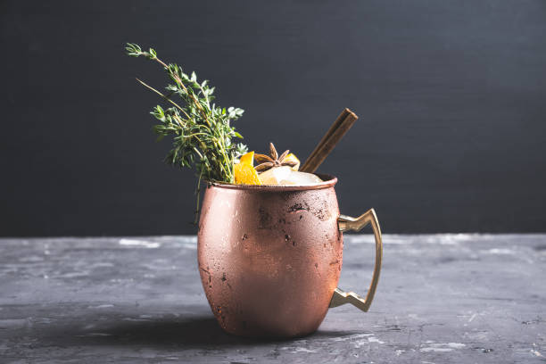 istock Cold orange Moscow mule cocktail in copper mug 941446460