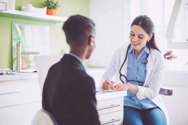 istock Doctor consulting her patient 941446642