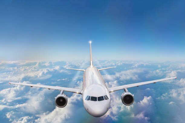 istock Commercial airplane flying above clouds 941447574