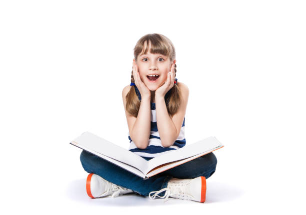 istock girl reading a book on white background 941450514
