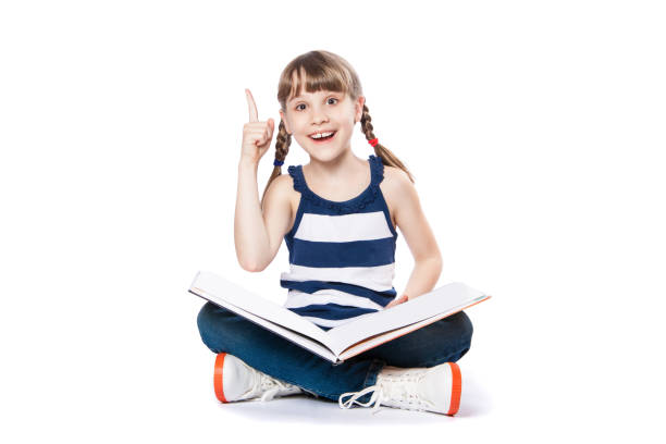 istock girl reading a book on white background 941450548