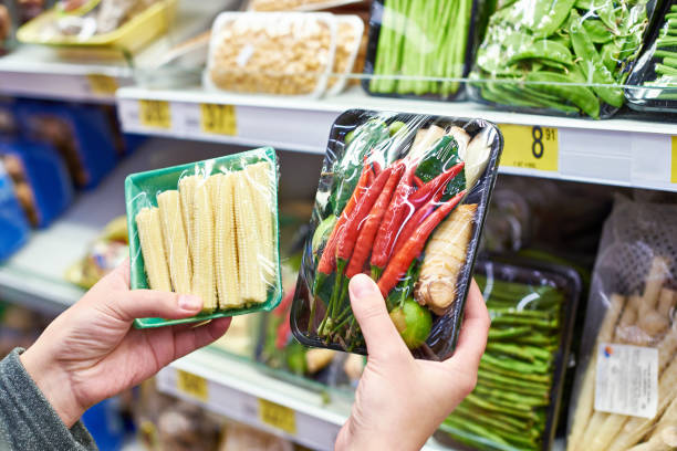 istock Buyer chooses fresh vegetables in shop 941451092