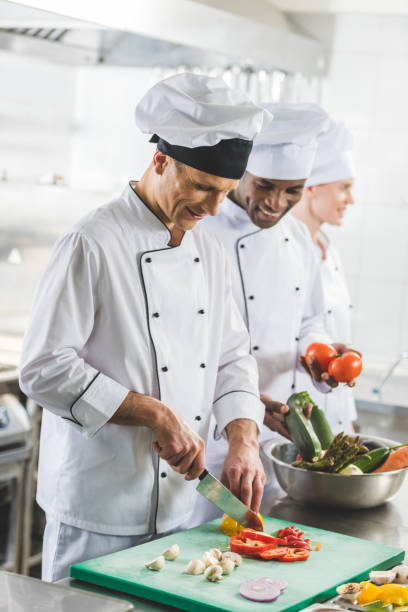 istock smiling multicultural chefs preparing food at restaurant kitchen 941461914