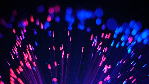 istock Blue and red fibre optic lights and particles 941461998