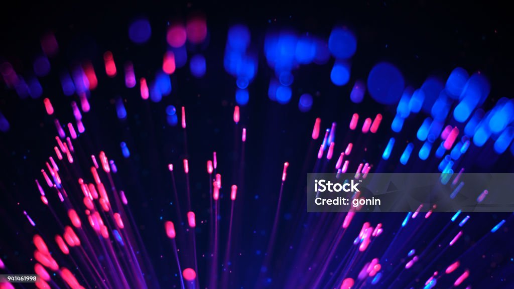 Blue and red fibre optic lights and particles Blue and red fibre optic lights and glowing particles Magenta Stock Photo