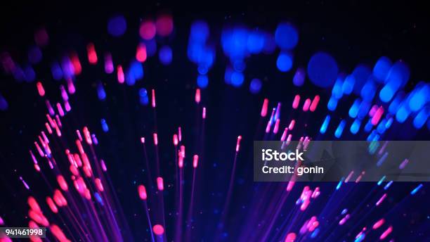 Blue And Red Fibre Optic Lights And Particles Stock Photo - Download Image Now - Magenta, Connection, Speed