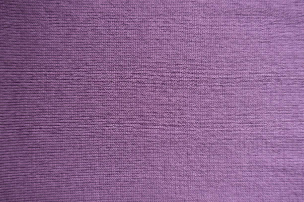 istock Texture of simple pink handmade knitted fabric 941462766