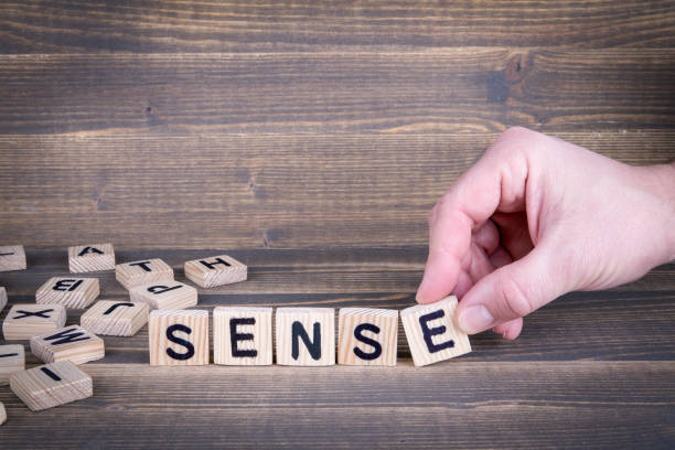 istock Sense. Wooden letters on the office desk 941463574