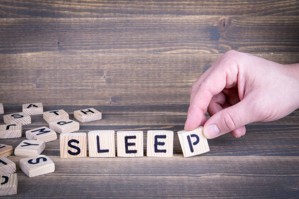 istock Sleep. Wooden letters on the office desk 941463660
