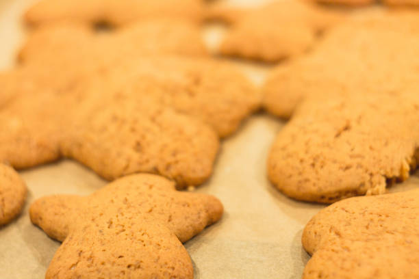 istock Ginger biscuits lie on a baking sheet. Cookies on baking paper 941468092