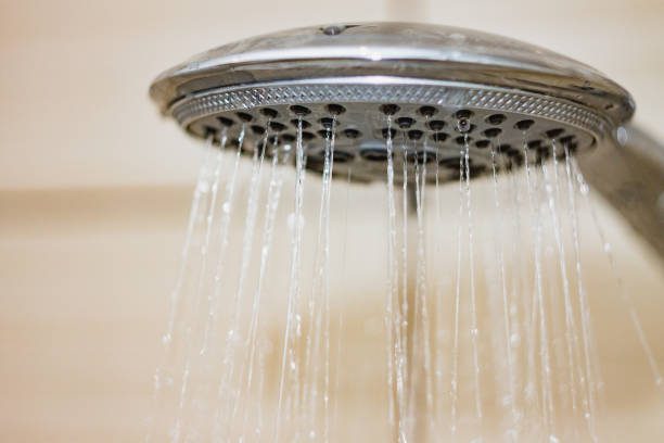 istock shower head with drops of water falling down 941468134