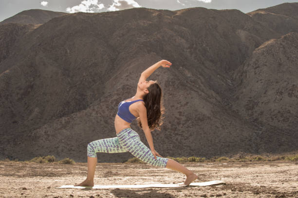 istock Hispanic Women Doing Yoga In The Desert 941468582