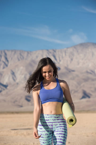 istock Hispanic Women Doing Yoga In The Desert 941469014