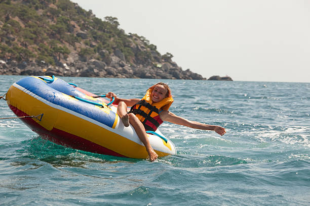 istock Happy couple tubing 94147525