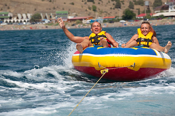 istock Happy couple tubing 94147711