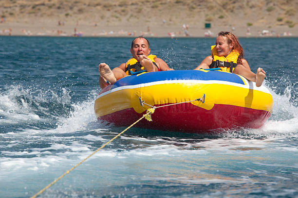 istock Happy couple tubing 94147760