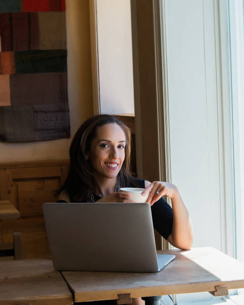 istock Thoughtful businesswoman sitting at cafe table 941478400