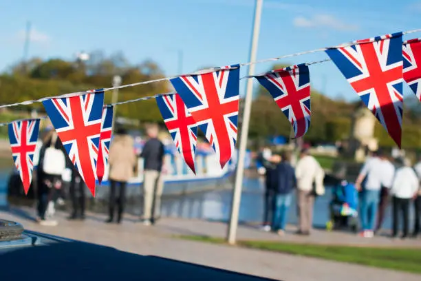 UK Warwickshire bright union jack flag triangle bunting with typical British background
