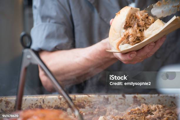 Man Preparing Sandwich With Fresh Hot Meat From Serving Tray Stock Photo - Download Image Now