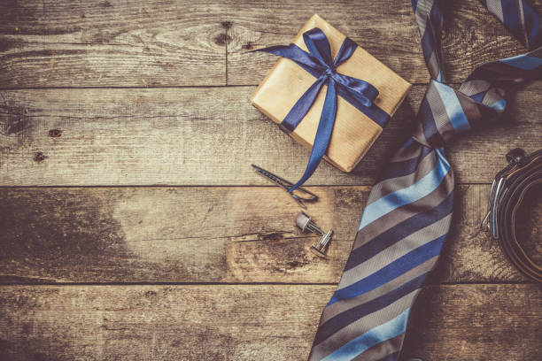 istock Father's day concept - present, tie on rustic wood background 941481092