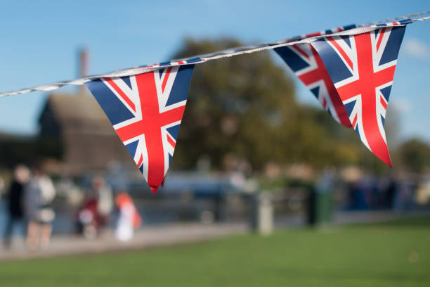 istock typical English garden party scene with triangular British Royal bunting. 941481440