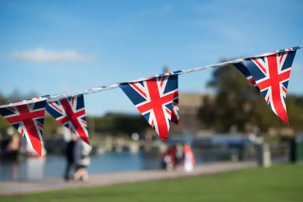 UK Warwickshire bright union jack flag triangle bunting with typical British background