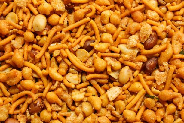 istock Mixture / Indian spicy snack mix background 941481746