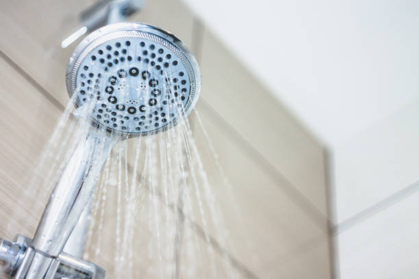 istock shower head with drops of water falling down 941482120