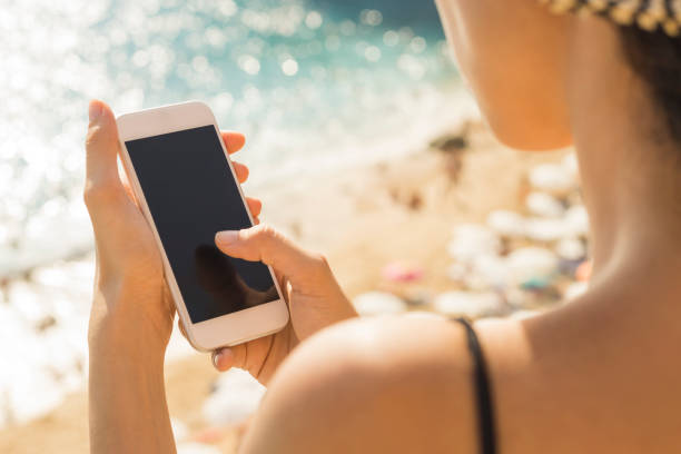 istock Hand holding phone blank screen and finger touching 941485134
