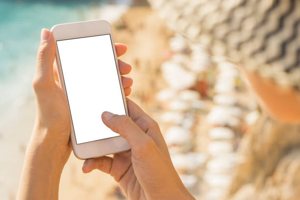 istock Hand holding phone blank screen and finger touching 941485142