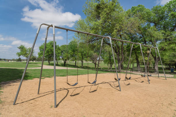 istock Huge swing set in nature park with tree lush at Ennis, Texas, USA 941485262